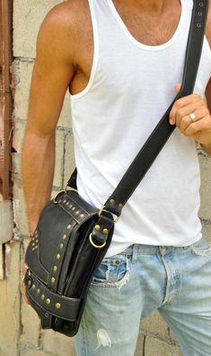 "Guys, you need this stylish shoulder bag for essentials, like your notebook or mini laptop devices, your phone, journal, wallet and keys. And, ladies, you already know how beneficial crossbody handbags are and this one is hard-core, smokin' biker bad. Oversized brass nailhead studs and an edgy geometric design make this an artistic statement that'll enhance even a basic, solid color t-shirt. Functional and secure, this hip bag features 2 exterior zipper compartments, 1 interior zipper compartme Phone Journal, Brown Leather Messenger Bag, Stylish Leather Bags, Sling Bag For Men, Leather Hip Bag, Mini Laptop, Leather Sling Bag, Studded Bag, Leather Laptop Bag