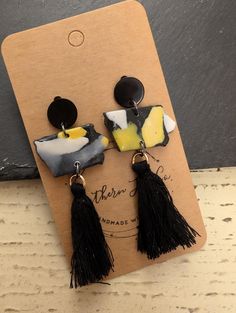 Iowa State earrings in black and yellow. Black Drop Tassel Earrings As Gift, Yellow Tassel Earrings As Gift, Clay Lsu Earrings, Black Tassel Earrings As Gift, Handmade Yellow Tassel Earrings For Summer, Handmade Artsy Yellow Earrings, Yellow Dangle Tassel Earrings Gift, Black Tassel Earrings For Gift, Funky Yellow Handmade Earrings