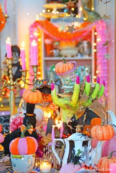 a table topped with lots of halloween decorations