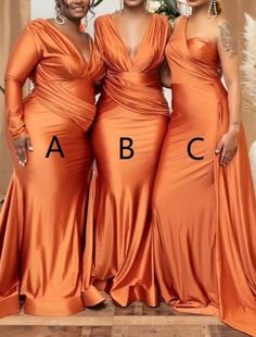 three women in orange dresses standing next to each other with the letters abc on them