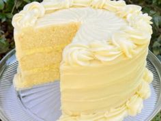 a close up of a cake on a plate with the words lemon cream cake above it