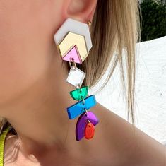 A colorful pair of clip on earrings that is made from different plexiglass pieces that is connected part by part by hand with every detail. You can find them only at Christina Christi Store. MATERIALS - Plexiglass Parts. - Metal Parts. - Clip On Earrings. DIMENSIONS - Total length of Clip On Earrings: 10 cm (3,9'') - Total length of Clip On Earrings: 3 cm (1.18'') PROTECTION - Protect them from water, parfumes, hair and body lotion to keep them bright and shiny for years. In this link you can se Open Cuff Bracelet, Trendy Earrings, Silver Bangle Bracelets, Big Earrings, Earrings Long, Sterling Silver Cuff, Silver Cuff Bracelet, Earrings Collection, Earrings Dangle