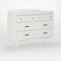 a white dresser with six drawers and two baby cribs on it's sides