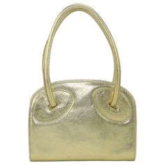 Laura Biagiotti Attributed Gold Leather Handbag, 1970's | From a unique collection of rare vintage Top Handle Bags at https://www.1stdibs.com/fashion/handbags-purses-bags/top-handle-bags/. Essence Types, Gamine Essence, Lb Logo, Classic Essence, Flamboyant Gamine, Evening Accessories, Designer Top, Chic Leather, Top Handle Bags