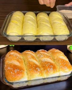 two trays filled with different types of bread