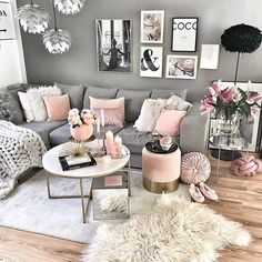 a living room filled with lots of furniture and pictures on the wall above it's coffee table