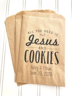 two brown paper bags with the words jesus and cookies printed on them are sitting next to each other