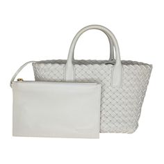 Bottega Veneta tote bag in signature Intrecciato lambskin leather in white. Featuring dual rolled top handles, gold-tone hardware, a removable, adjustable crossbody strap, open top with magnetic closure, spacious interior with a removable leashed zip pouch bag. Bottega Veneta dust bag included. Made in Italy. Retail $5,200. Designer: Bottega Veneta Material: Intrecciato woven Lambskin leather Measurements: 7.9"W x 5.9"H x 4.7"D Drop: 3" handle; 23.25" strap Interior Lining: Unlined Opening/Closu Classic Intrecciato Shoulder Bag For Shopping, Classic Intrecciato Weave Shoulder Bag For Shopping, Classic Tote Bag With Intrecciato Weave, Classic Top Handle Bag With Intrecciato Weave, White Intrecciato Weave Bag For Travel, White Intrecciato Weave Travel Bag, White Intrecciato Weave Bag For Daily Use, White Top Handle Bag With Intrecciato Weave, White Double Handle Bag With Intrecciato Weave