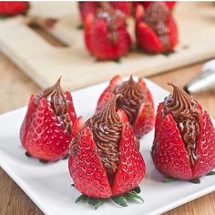 chocolate covered strawberries on a white plate