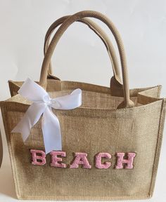 a beach bag with the word beach on it