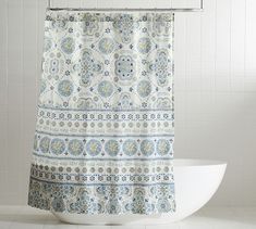 a shower curtain with a blue and white pattern on it