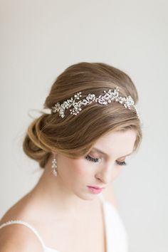 a woman wearing a bridal head piece