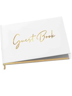 a white guest book with gold lettering on the front and back cover that says guest book