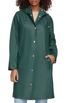 Durable and versatile, this hooded rain jacket features a drawstring hood, covered zipper placket and welt pockets to keep your hands warm and dry. 38 1/2" length Drawstring hood Water-resistant 100% polyurethane Machine wash, tumble dry Imported Green Windbreaker For Fall, Green Casual Raincoat For Rainy Weather, Casual Green Raincoat For Rainy Weather, Green Waterproof Parka For Fall, Green Weatherproof Raincoat For Spring, Green Raincoat With Detachable Hood For Fall, Fall Waterproof Green Parka, Green Raincoat With Adjustable Hood For Spring, Green Hooded Raincoat With Drawstring