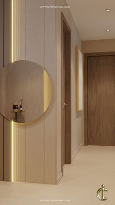 the interior of a modern bathroom with an oval mirror and gold faucet on the wall