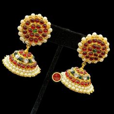 Design by Classical Dance Jewelry® ❥ Colorful and Designer traditional big pearl top and normal butta or jhumka Kemp temple Indian Jewelry Earrings in Red, Green stones combo ❥ Model no: EA-10 ❥ Age : 5 yrs and up ❥ You Can wear this set especially for Bharatnatyam And Kuchipudi Dance Performances and in Parties, Engagement, Weddings, Birthdays. ❥ Handmade Indian Item. ❥❥❥ Set includes ☛ Earrings pair ❇️ Imitation Jewelry by nature is little soft compared to real jewelry so little shape variatio Temple Jewelry Tikka For Eid Celebration, Temple Jewelry Style Tikka For Eid Celebration, Red Jhumkas For Ceremonial Use During Diwali, Temple Jewelry Pearl Earrings With Latkans For Celebration, Festive Temple Jewelry Pearl Earrings With Latkans, Eid Celebration Temple Jewelry Tikka, Kundan Pearl Earrings For Festivals In Temple Jewelry Style, Heavy Temple Jewelry Pearl Earrings For Celebration, Festive Temple Jewelry Pearl Earrings With Cutdana