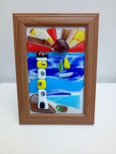 a wooden frame with some colorful items in it