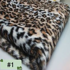 an animal print area rug with the number one on it's bottom and side