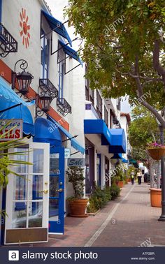 an empty street lined with shops and restaurants