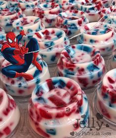 many red, white and blue desserts with spiderman on them