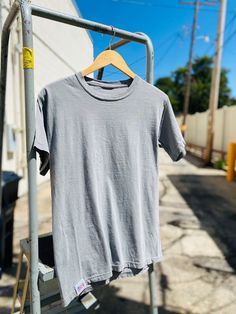 Meet your new go-to shirt. Our new shop shirt's are a regular fit with a washed vintage feel. Features: ﻿-100% ring spun cotton-Soft washed garment dyed fabric-Double needle collar-Twill taped neck and shoulders-Twill label Twill Tape, New Shop, Comfort Colors, Shirt Shop, Mens Graphic Tshirt, Ring, Grey, Mens Tshirts, Mens Tops