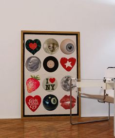 a white chair sitting in front of a poster with different types of buttons on it