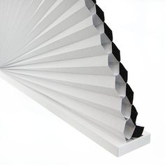 an angled view of a white wall with black lines on it