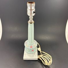 a glass lamp with a cord attached to it