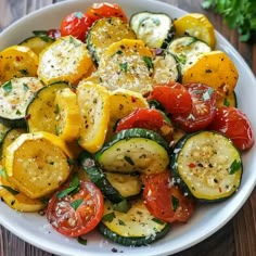 a white bowl filled with sliced up vegetables on top of a wooden table and garnished with parsley