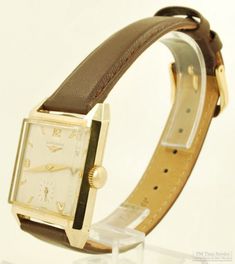 Longines grade 23Z vintage wrist watch, 17 jewels, heavy yellow gold (filled) rectangular smooth polish case Yellow Gold Business Watches With Rectangular Shape, Yellow Gold Business Watch With Rectangular Shape, Classic Analog Rectangular Watch Accessories, Formal Yellow Gold Rectangular Watch Bands, Formal Rectangular Yellow Gold Watch Bands, Classic Yellow Gold Watch Bands With Rectangular Dial, Brown Rectangular Watch For Formal Occasions, Classic Square Analog Watches, Classic Square Analog Watch