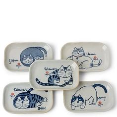 four plates with cats painted on them