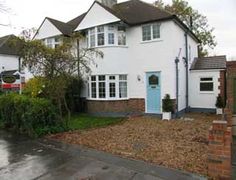 a white house with blue door and windows