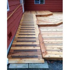 a wooden deck with steps leading up to it