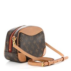 This is an authentic LOUIS VUITTON Monogram Deauville Mini. This classic tote bag is finely crafted of classic Louis Vuitton monogram coated canvas. The bag features a full exterior pocket, vachetta cowhide leather trim and polished brass hardware. The double wrap-around zipper opens to a burgundy fabric interior with a pocket. Classic Tote Bag, Burgundy Fabric, Brass Hardware, Polished Brass, Authentic Louis Vuitton, Leather Trim, Cowhide Leather, Leather Trims, Louis Vuitton Monogram