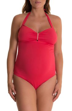 A ruched one-piece swimsuit with a halter neckline features side boning and an elastic band under the bust to provide added support for your changing figure. Style Name:Pez D'Or Solid One-Piece Maternity Swimsuit. Style Number: 473667. Available in stores.