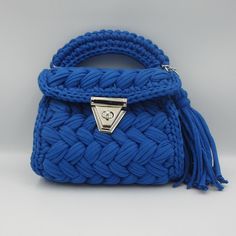 Luxury Crochet Bag - Capri Knit Royal Blue Shoulder Bag - Handmade Boho Designer Tote, Elegant Artisanal Crossbody Bag Introducing our luxurious Capri Knit Royal Blue Crochet Bag, a perfect blend of elegance and practicality. This handmade boho shoulder bag is meticulously crafted to bring a unique touch of sophistication to your style. Its vibrant royal blue color and intricate knit pattern make it an eye-catching accessory for any occasion, whether it's a casual outing or a special event. Feat Blue Top Handle Shoulder Bag With Braided Handles, Blue Top Handle Bags With Braided Handles, Blue Knitted Shoulder Bag For Daily Use, Blue Bags With Braided Top Handles, Blue Knitted Shoulder Bag For Everyday, Blue Hand Knitted Rectangular Bag, Blue Woven Top Handle Bag, Blue Handwoven Top Handle Bag, Handmade Blue Pouch Shoulder Bag