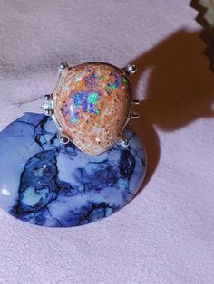 Large 8.64 Mexican cantera fire opal with nice blues and purple, set in a four prong open style silver ring Unique Opal Gemstone Rings, Unique Multi-stone Oval Opal Ring, Unique Sterling Silver Opal Ring With Accent Stones, Unique Opal Ring With Accent Stones, Unique Oval Opal Ring With Large Stone, Unique Ethiopian Opal Cabochon Rings, Unique Cabochon Opal Ring For Collectors, Unique Oval Cabochon Opal Ring, Silver Ethiopian Opal Ring With Multiple Stones