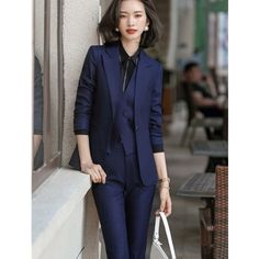 If you have a penchant towards style, there isn't a better option than this women's business suit. The cool blazer and pant combo made from premium-grade broadcloth fabric is comfortable to wear and notch up your glamour quotient at office meetings. This blazer will boost your summer fun and can be customized.  

Specifications
Brand Name: GeraldBlack
Material: Polyester
Material: Microfiber
Material Composition: Blazer+Microfiber
Clothing Length: Regular
Collar: Notched
Pant Closure Type: Butto Pantsuits For Women Business, Blue Coat Pant, Pantsuit For Women, Formal Uniform, Dark Blue Suit, Broadcloth Fabric, Formal Wear Women, Purple Coat, Suit For Women