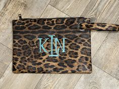 "Leopard Wristlet Available in Dark Leopard, Light Leopard and Grey Leopard The Leopard Print Wristlet Purse is a fancy fun bag that is perfect for your special occasion or your everyday. Description: 13\" L x 9\" H 100% Polyester 6.25\" Wrist Strap Polyester Lining Interior Zipper Pocket 2 Interior Open pockets on opposite side You can choose to have this item monogrammed or leave it as is. ORDERING INFORMATION Please put the following information in the \"Notes to Seller\" at checkout: 1. Name Rectangular Clutch With Wrist Strap Gift, Gift Wristlet Clutch With Wrist Strap, Gift Wristlet With Wrist Strap, Gift Clutch Wristlet With Wrist Strap, Pouch Wristlet As Gift, Pouch Wristlet With Wrist Strap As Gift, Wristlet Pouch With Wrist Strap As Gift, Rectangular Wristlet With Zipper Pouch As Gift, Bunny Backpack