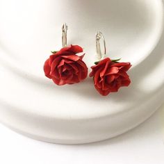 These red rose earrings are fully handmade. Each element is made entirely by hands from material called cold porcelain and toned with soft pastel. These flowers look much like fresh flowers but they will never fade. I use only non-allergic nickel free bases for my items.Diameter of flower – 1 inches (2,5 cm)Sterling silver metalThese earrings with pink roses are perfect for woodland, greenery or rustic weddings and other celebrations. But also they will be good even as casual accessory. Flowers Rose Red Flower Shaped Earrings For Gift, Handmade Rose Red Flower Earrings, Red Flower-shaped Earrings For Spring, Red Rose Earrings, Rose Red Flower-shaped Earrings With Rose Design, Red Flower Earrings, Rose Red Flower-shaped Earrings, Floral Hair Pieces, Flower Lapel Pin