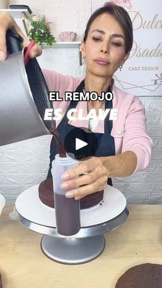 a woman pouring chocolate cake into a cup