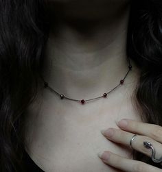 Artemis Dreaming. Βeauty and magic in the most delicately dark way. This necklace is composed of black rhodium over 925 sterling silver delicate sparkling chain, 4 mm round burgundy garnet gemstones. You can choose between these chain lengths: 15 / 16 / 17 / 18 inches Not sure which length to buy? We can add a 1 inch extender chain. Just write a note at checkout! ❈ We send all our items with registered mail. ❉ Due to the organic nature of stones, there might be a slight variation in colour, size and shape. ✺ All items come packaged in a quality velvet pouch ready for gift giving. ✽ If you want to make a special order, just contact us! Dainty Gothic Jewelry, Gothic Sterling Silver Choker, Gothic Sterling Silver Choker Necklace, Gothic Sterling Silver Choker Jewelry, Elegant Clavicle Chain Necklace For Halloween, Gothic Gemstone Necklace For Gift, Gothic Sterling Silver Necklaces For Parties, Gothic Garnet Jewelry For Gift, Elegant Sterling Silver Halloween Necklace