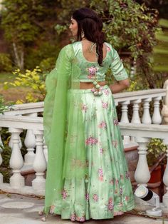 This Set Has Choli, Lehenga & Dupatta. Floral printed lehenga with organza sequins hand work dupatta. Color: Pistachio Green Fabric: Lehenga & Blouse- Satin Dupatta - Organza Product Details: Neck Type - Round neck Top Length - 14-15 inches Bottom Length - 40-42 inches Sleeve Length - 12 inches Note: The product will be delivered within 2-4 weeks of order placed Wash Care - Dry clean only Measurements: XXS : Chest = 32 | Waist = 28 | Hip = 34 XS : Chest = 34 | Waist = 30 | Hip = 36 S : Chest = 3 Green Art Silk Set With Unstitched Blouse, Festive Green Unstitched Blouse Set, Festive Pista Green Sharara With Unstitched Blouse, Festive Green Set With Unstitched Blouse, Green Silk Choli For Eid, Green Organza Choli For Eid, Festive Pista Green Lehenga With Unstitched Blouse, Pista Green Lehenga With Unstitched Blouse For Festive Occasions, Festive Pista Green Anarkali Set With Unstitched Blouse