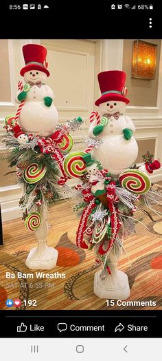 two snowmen are decorated with candy canes