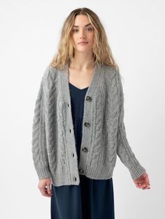 Indulge in cozy sophistication with our chunky Cable Knit Cardigan. Meticulously crafted from a blend of yak, alpaca, recycled nylon, and extra fine merino wool, this roomy midweight cardigan offers unparalleled warmth and texture. This chunky cable knit cardigan effortlessly elevates any outfit, making it a true staple in any wardrobe, with its generous and comfortable oversized fit. Due to the inherent quality of the natural fibers, you may notice shedding. Cozy Cotton Cable Knit Cardigan, Oversized Soft Knit Cotton Cardigan, Oversized Cable Knit Cotton Cardigan, Oversized Long Sleeve Cable Knit Cardigan, Wool V-neck Cable Knit Cardigan, Chunky Cable Knit Cardigan, Chunky Cable Knit, Cable Knit Cardigan, Back Women