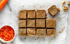 sliced carrots and brownies next to a bowl of chopped carrots