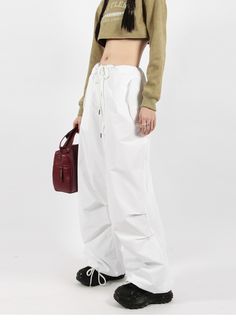 There’s a new trend in town, and it’s nightcity clothing’s Button Pocket Oversized Parachute Pants. These comfy, lightweight pants look great when paired with a crop top or graphic tee and sneakers. With a drawstring waistline, these pants are comfortable and secure, and the oversized fit gives them an effortless and chill look. Add these pants to your wardrobe, and you’ll never have a dull moment — you’ll always be ready for an impromptu night out, no matter how casual it might be.
Gender: Wome