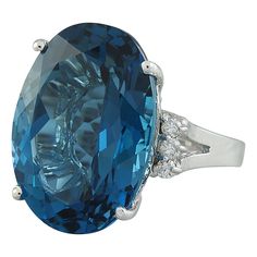 Stamped: 14K Total Ring Weight: 6.2 Grams Topaz Weight 25.00 Carat (20.00x15.00 Millimeters)Diamond Weight: 0.30 carat (F-G Color, VS2-SI1 Clarity )Face Measures: 20.00x20.90 Millimeter SKU: [600498] Luxury Blue Topaz Diamond Ring For Formal Occasions, Luxury Formal Blue Topaz Diamond Ring, Luxury Diamond Cut Gemstones For Formal Occasions, Luxury Topaz Ring With Brilliant Cut For Formal Occasions, Luxury Oval Diamond Topaz Ring, Oval Diamond Gemstones For Formal Occasions, Formal Oval Diamond Gemstones, Formal Blue Topaz Diamond Ring With Vvs Clarity, Dazzling Sapphire Ring With Diamond Accents For Formal Events