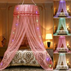 the canopy bed is decorated with pink and blue lights