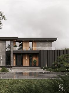 a modern house with wooden doors and windows on the outside, surrounded by greenery